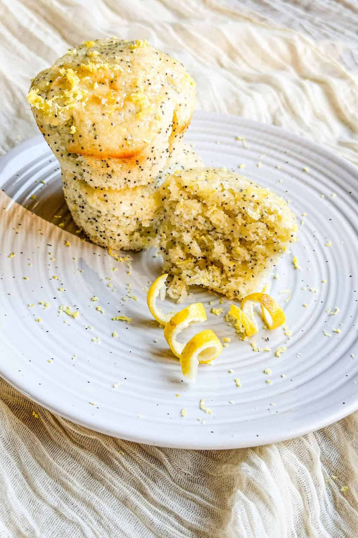 Bright, tangy lemon muffins topped with poppy seeds, ideal for Easter celebrations or spring gatherings.