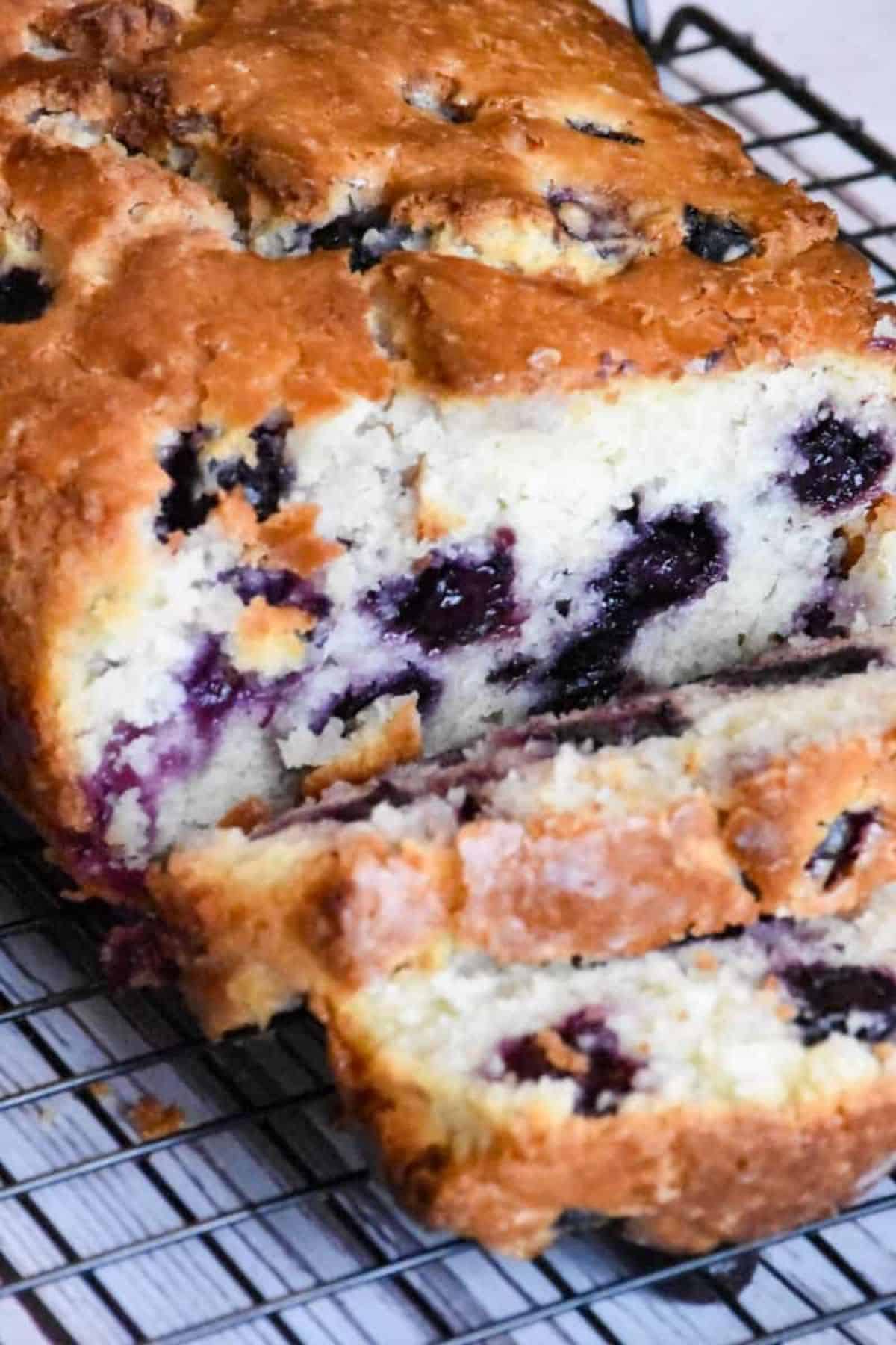 Delicious homemade blueberry loaf with a golden crust and juicy berries inside. Perfect for brunch or breakfast.