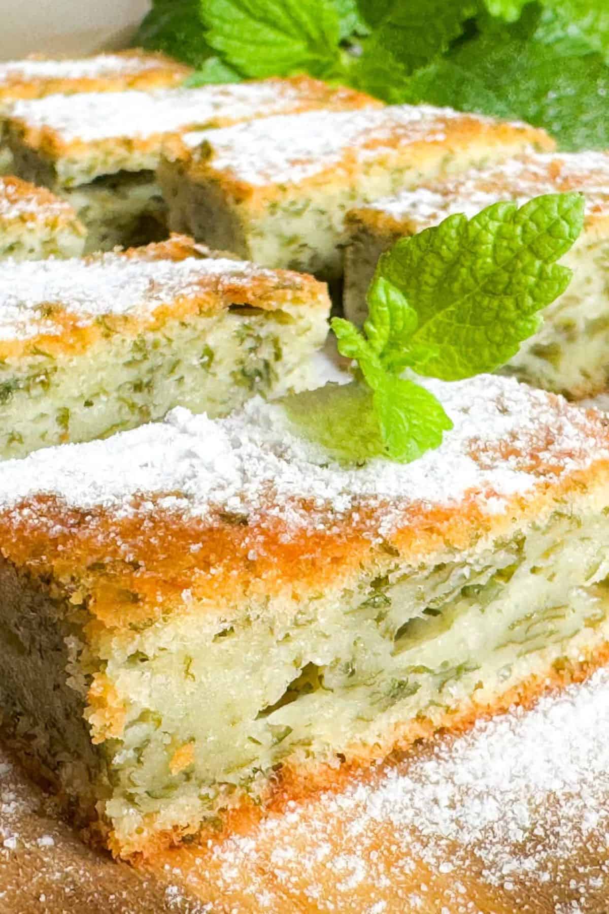 Creamy, cheesy sweet potato hash brown casserole topped with fresh mint leaves.