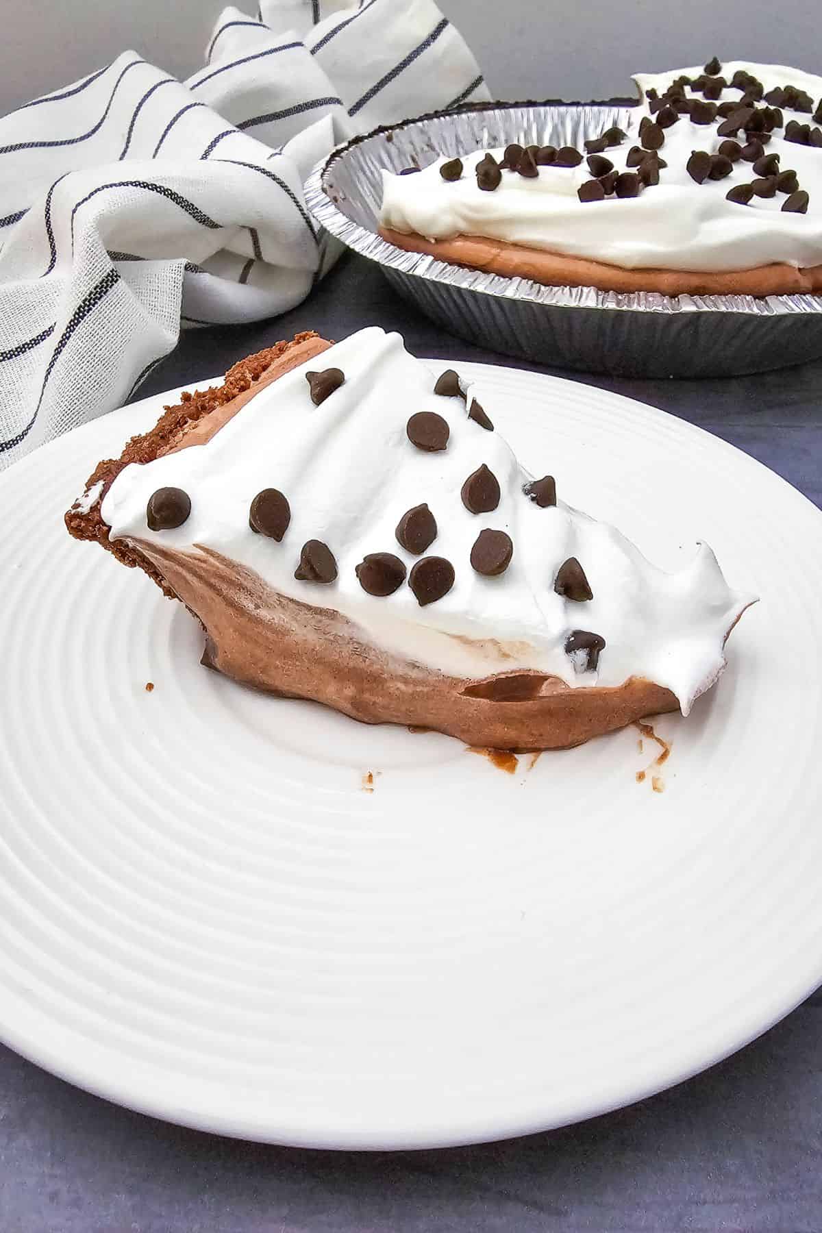Delicious chocolate and whipped cream Easter dessert pie topped with chocolate chips. Perfect for sp.
