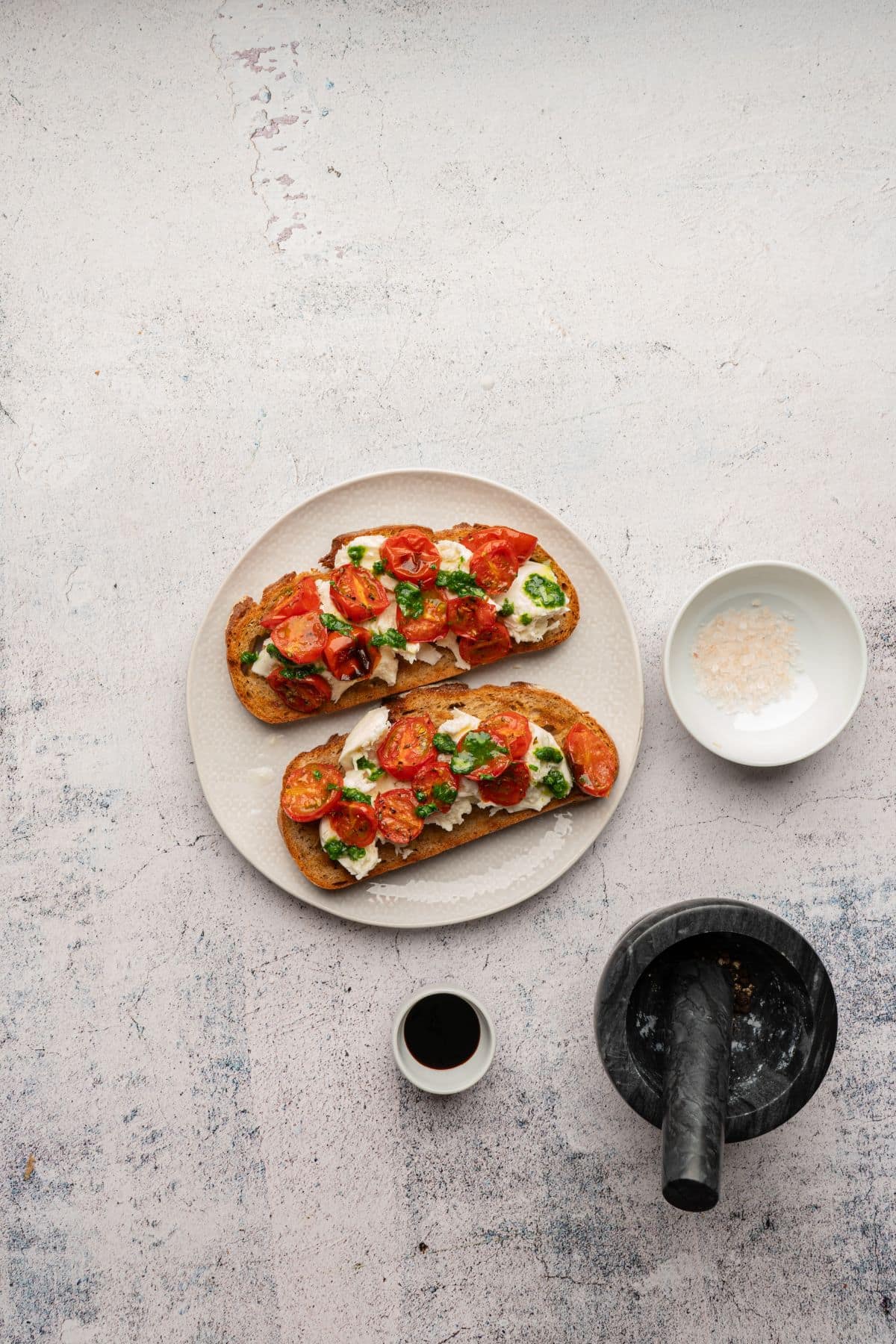 Fresh cherry tomatoes, basil, mozzarella, and toasted baguette slices.