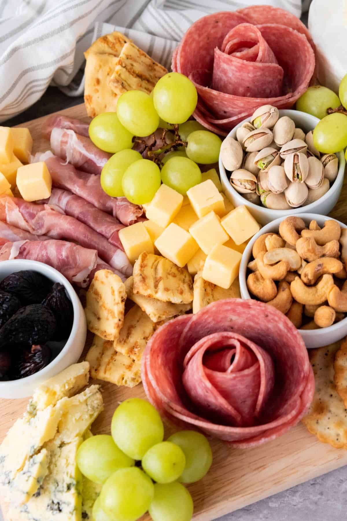 Delicious cheese, cured meats, grapes, nuts, and crackers perfect for Easter snacking.